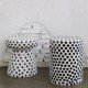 Tabouret de jardin en céramique à pois noirs et blancs